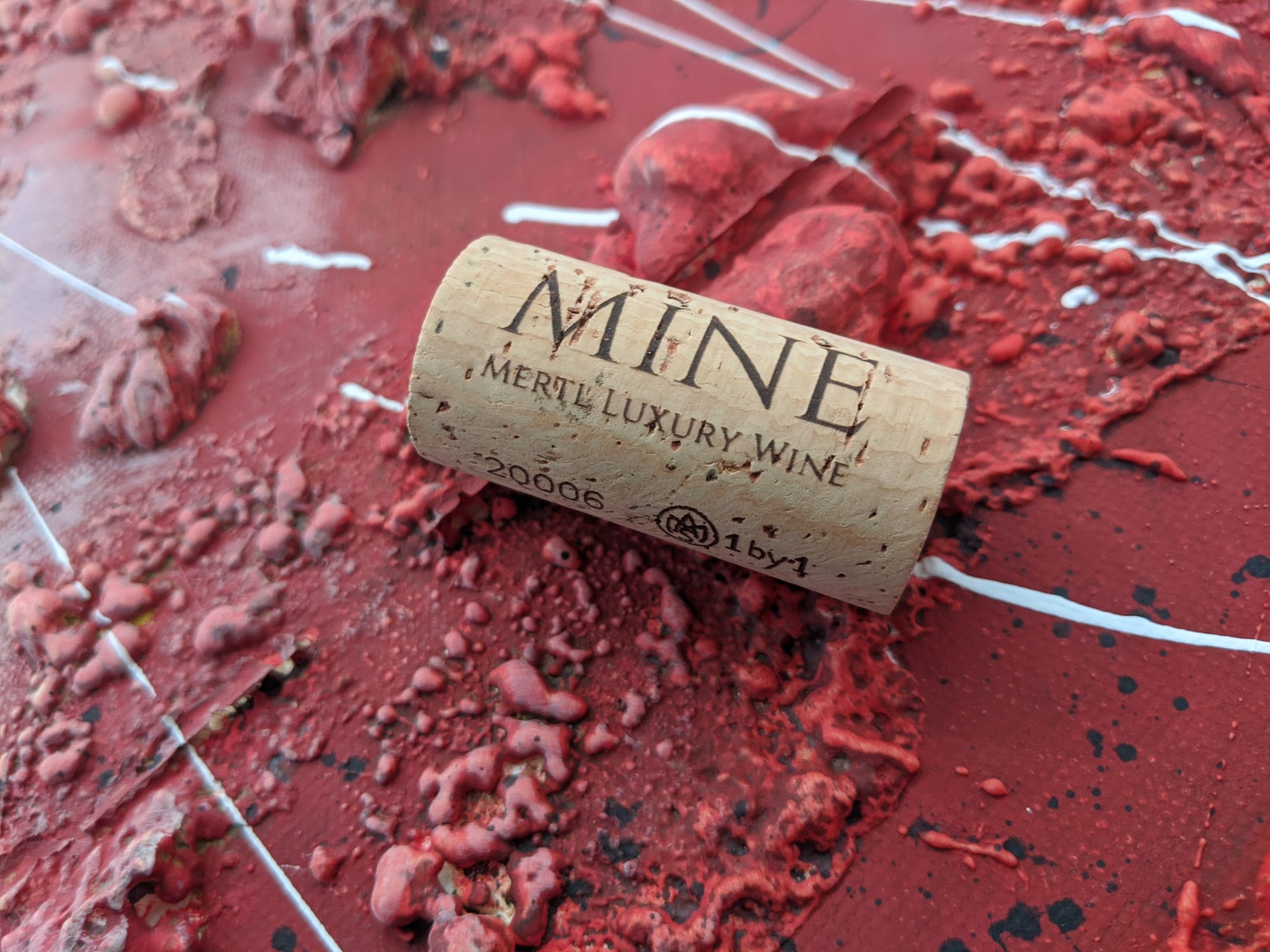 MINE cork resting on the wine bottle